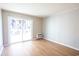 Bright living room with hardwood floors and sliding door to balcony at 300 47Th Ave. S # 1C, North Myrtle Beach, SC 29582