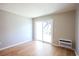 Light-filled living area with hardwood floors and access to a balcony at 300 47Th Ave. S # 1C, North Myrtle Beach, SC 29582