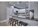 Modern kitchen with white cabinets, granite countertops, and breakfast bar at 3750 Kingsley Dr., Myrtle Beach, SC 29588