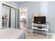 Bedroom with twin bed, TV, and view into dining area at 4753 Wild Iris Dr. # 104, Myrtle Beach, SC 29577