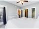 Main bedroom with king bed, dresser, and access to bathroom at 4753 Wild Iris Dr. # 104, Myrtle Beach, SC 29577