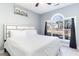 Main bedroom with king-size bed and large window with backyard view at 4753 Wild Iris Dr. # 104, Myrtle Beach, SC 29577
