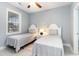 Two twin beds, nightstand, and window in a well-lit bedroom at 4753 Wild Iris Dr. # 104, Myrtle Beach, SC 29577
