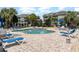 Relaxing community pool with plenty of lounge chairs and umbrellas at 4753 Wild Iris Dr. # 104, Myrtle Beach, SC 29577