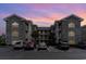 Two-story building exterior with brick facade and parking lot at 4753 Wild Iris Dr. # 104, Myrtle Beach, SC 29577
