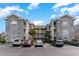 Two-story building exterior with brick facade and parking lot at 4753 Wild Iris Dr. # 104, Myrtle Beach, SC 29577