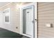 Exterior view of building entrance with address number 104 at 4753 Wild Iris Dr. # 104, Myrtle Beach, SC 29577
