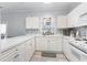 White kitchen with appliances, good counter space, and storage at 4753 Wild Iris Dr. # 104, Myrtle Beach, SC 29577