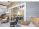 Screened-in patio with wicker furniture and sliding glass doors at 4753 Wild Iris Dr. # 104, Myrtle Beach, SC 29577