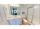 Well-lit bathroom with a shower-tub, toilet, and vanity with cabinet storage at 5300 Ocean Blvd. N, North Myrtle Beach, SC 29582