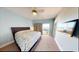 Bright bedroom featuring a king-size bed, TV, and sliding glass doors leading to a deck with ocean view at 5300 Ocean Blvd. N, North Myrtle Beach, SC 29582