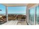 Outdoor deck with table and chairs, covered area, and panoramic views of the beach at 5300 Ocean Blvd. N, North Myrtle Beach, SC 29582