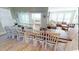 Spacious dining room featuring a large table with seating for ten, with access to beautiful outdoor views at 5300 Ocean Blvd. N, North Myrtle Beach, SC 29582