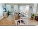 Spacious dining room featuring a large table with seating for ten, with access to beautiful outdoor views at 5300 Ocean Blvd. N, North Myrtle Beach, SC 29582