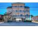 Stunning three-story beach house with multiple balconies and ample covered parking at 5300 Ocean Blvd. N, North Myrtle Beach, SC 29582