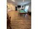 Large entertainment room featuring a pool table and additional counter space with refrigerator at 5300 Ocean Blvd. N, North Myrtle Beach, SC 29582