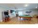 Entertaining game room with a pool table, arcade machine, and comfortable seating at 5300 Ocean Blvd. N, North Myrtle Beach, SC 29582
