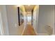 Hallway with neutral paint and carpet leading to the bedrooms and bathrooms at 5300 Ocean Blvd. N, North Myrtle Beach, SC 29582