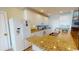 Well-equipped kitchen with granite countertops, white cabinetry, and stainless steel appliances at 5300 Ocean Blvd. N, North Myrtle Beach, SC 29582