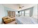 Cozy main bedroom with seating area, access to outdoor deck, and view of the ocean at 5300 Ocean Blvd. N, North Myrtle Beach, SC 29582