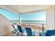 Covered outdoor patio featuring several chairs and offering beautiful views of the ocean at 5300 Ocean Blvd. N, North Myrtle Beach, SC 29582