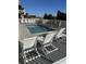 Relaxing outdoor pool area with lounge chairs and a white picket fence surround at 5300 Ocean Blvd. N, North Myrtle Beach, SC 29582