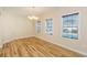 Bright dining room features hardwood floors, chandelier, and view of backyard pool at 588 Tourmaline Dr., Little River, SC 29566