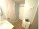 Small bathroom with tiled floor, a sink, and a door to another room at 5905 S Kings Hwy. # B130, Myrtle Beach, SC 29575