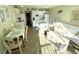 Open concept living and dining area with a tiled floor at 5905 S Kings Hwy. # B130, Myrtle Beach, SC 29575