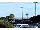 Partial ocean view from parking lot with palm trees at 5905 S Kings Hwy. # B130, Myrtle Beach, SC 29575