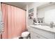 Clean bathroom with pink shower curtain and granite countertop at 704 Wheeler Ln., Longs, SC 29568