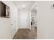 Clean and simple entryway with wood-look floors and neutral walls at 704 Wheeler Ln., Longs, SC 29568