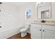 Bathroom features white cabinets, laminate floors, and bathtub with shower at 800 Caines Landing Rd., Conway, SC 29526