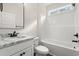 Bathroom features a tub, a sink with a mirror, and wood-look flooring at 800 Caines Landing Rd., Conway, SC 29526
