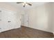 This bedroom has a ceiling fan, wood-look floors, and a closet at 800 Caines Landing Rd., Conway, SC 29526