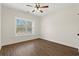 This bedroom has a ceiling fan, a window, and wood-look flooring at 800 Caines Landing Rd., Conway, SC 29526