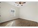 This bedroom has a ceiling fan, a window, and wood-look flooring at 800 Caines Landing Rd., Conway, SC 29526