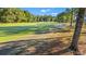 Picturesque golf course view showcasing lush greenery and a paved walking path at 800 Caines Landing Rd., Conway, SC 29526