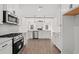 Modern kitchen with stainless steel appliances, granite countertops, white cabinetry, and an open layout at 800 Caines Landing Rd., Conway, SC 29526