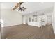 Open-concept living area with wood floors, vaulted ceilings, a kitchen island, and abundant natural light at 800 Caines Landing Rd., Conway, SC 29526