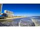 Oceanfront view with white sand beach and high-rise buildings at 807 Ireland Dr., Longs, SC 29568