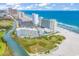 Aerial view of beachfront resort, pool, and ocean at 9400 Shore Dr. # 818, Myrtle Beach, SC 29572