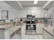 Galley kitchen with granite counters and stainless steel appliances at 9400 Shore Dr. # 818, Myrtle Beach, SC 29572