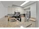 Galley kitchen with granite counters and stainless steel appliances at 9400 Shore Dr. # 818, Myrtle Beach, SC 29572