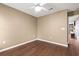 Simple bedroom with hardwood floors and ceiling fan at 100 Barnacle Ln. # 4, Little River, SC 29566