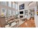 Bright living room with hardwood floors, large windows, fireplace and built-in bookshelves at 118 Oatland Lake Rd., Pawleys Island, SC 29585