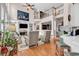 Open-concept living room with a fireplace, built-in shelves, and views of the second-floor balcony at 118 Oatland Lake Rd., Pawleys Island, SC 29585