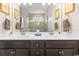 Modern bathroom with double vanity and a large mirror at 1262 Witch Hazel Way, Longs, SC 29568