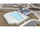Community pool with a pool house, lounge chairs, and surrounding fence at 1262 Witch Hazel Way, Longs, SC 29568