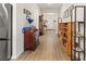 Long hallway with hardwood floors and built-in shelving at 1262 Witch Hazel Way, Longs, SC 29568